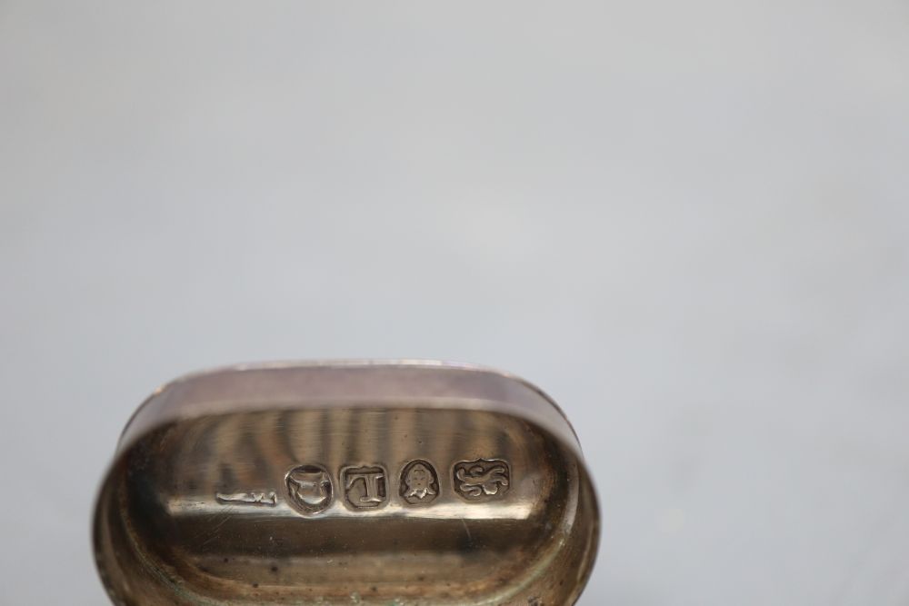 A George III silver oval nutmeg grater, ?B over JM, London, 1806, 34mm.